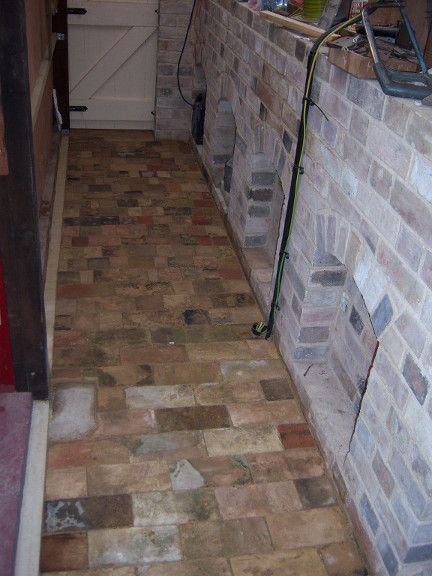 Pic of brick floor & wall & arches